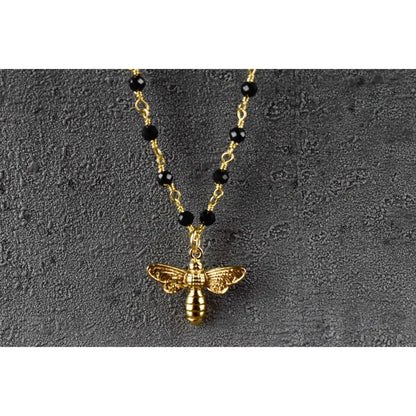 Madamlili onyx edelsteen ketting met bijenhanger goud.