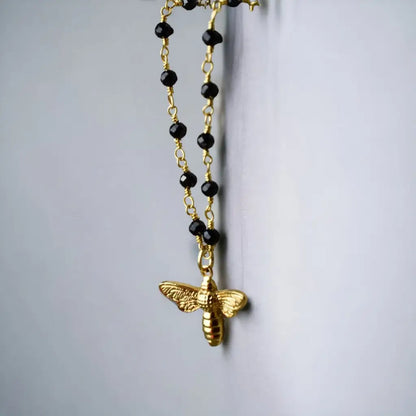 Madamlili onyx edelsteen ketting met bijenhanger goud.