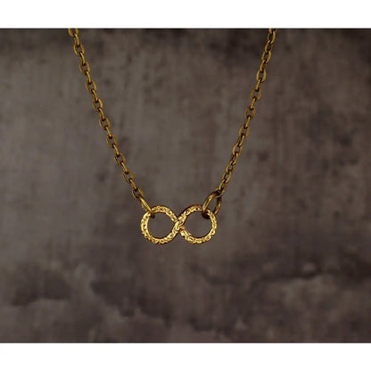 Madamlili infinity ketting - bronzen filigraan infinity.