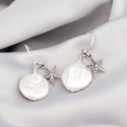 Parelmoer oorbellen met zeester - 925 sterling zilver
