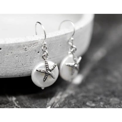 Parelmoer oorbellen met zeester - 925 sterling zilver