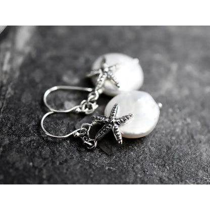 Parelmoer oorbellen met zeester - 925 sterling zilver