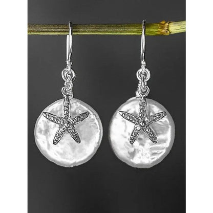 Parelmoer oorbellen met zeester - 925 sterling zilver